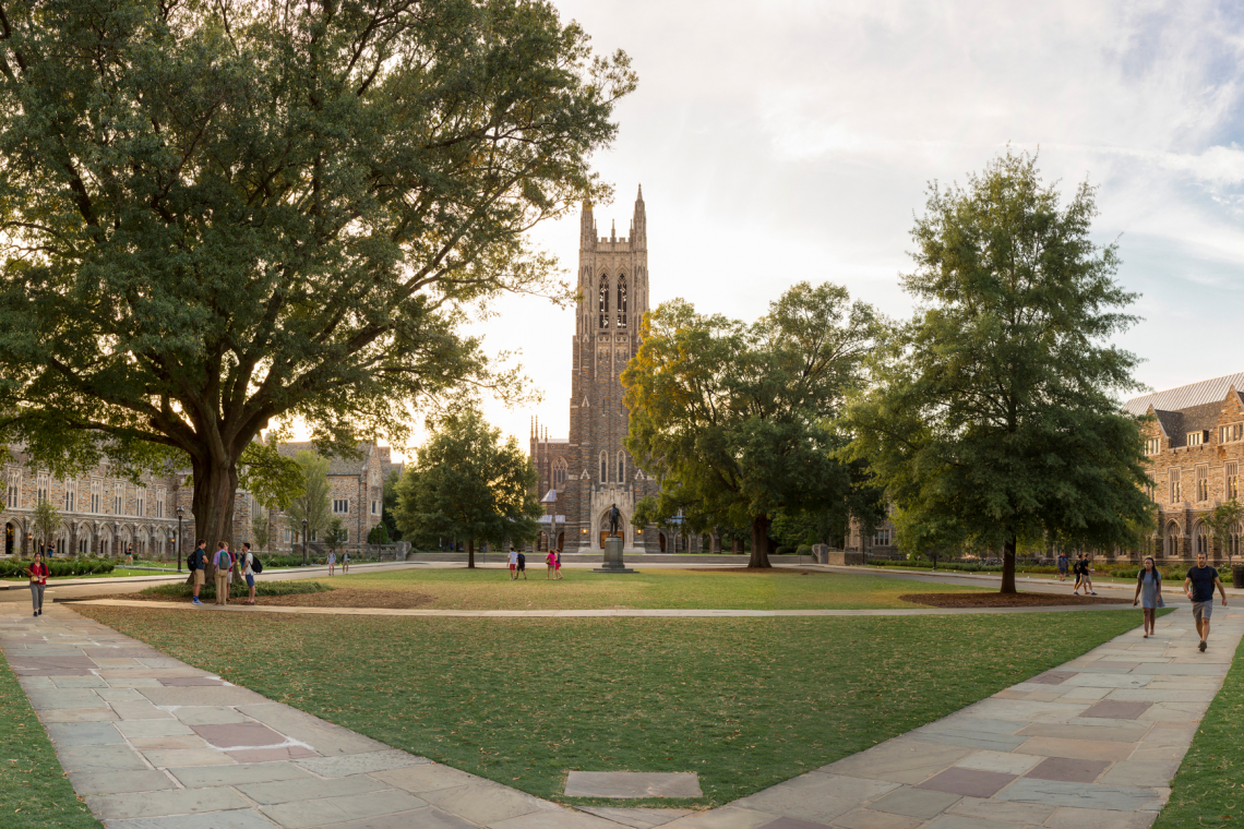 Students and others walk on Abele quad, named after the Black architect who designed much of West Campus.