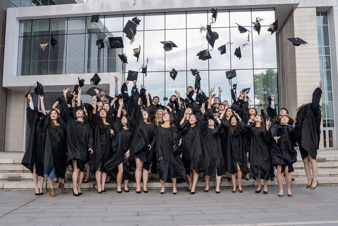 Duke Kunshan University MMS graduates celebrate following the awarding of degrees.