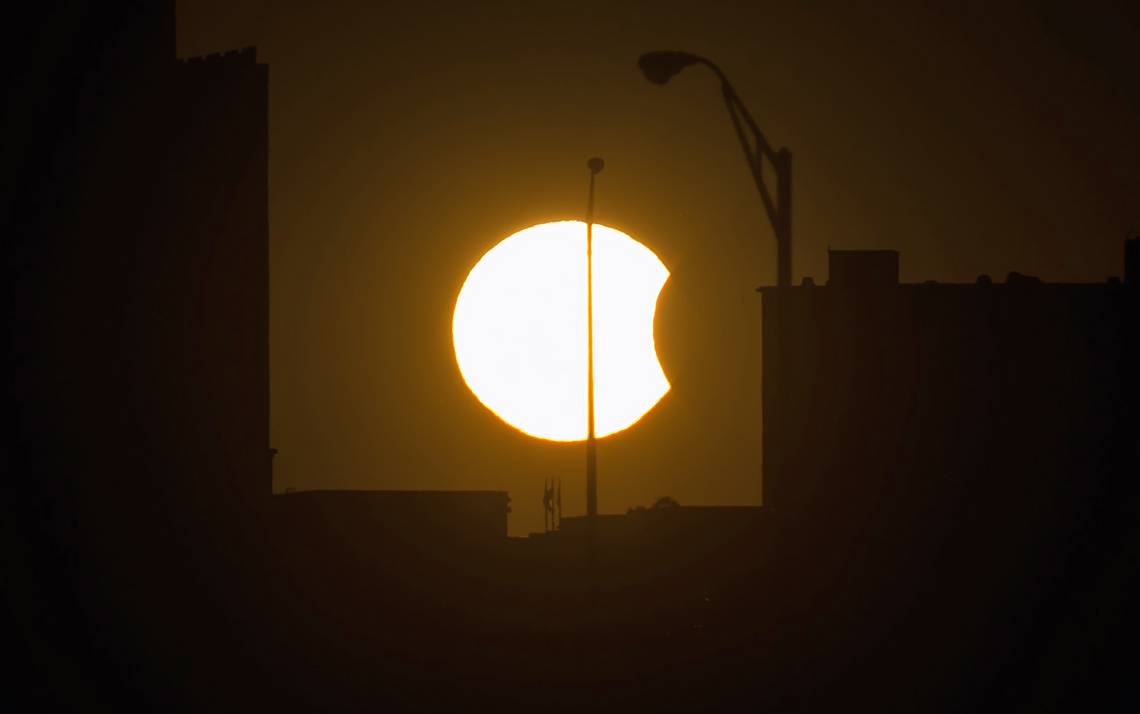 A partial solar eclipse is visible just before sunset Thursday, Oct. 23, 2014, in Arlington, VA. Photo by Bill Ingalls/NASA.