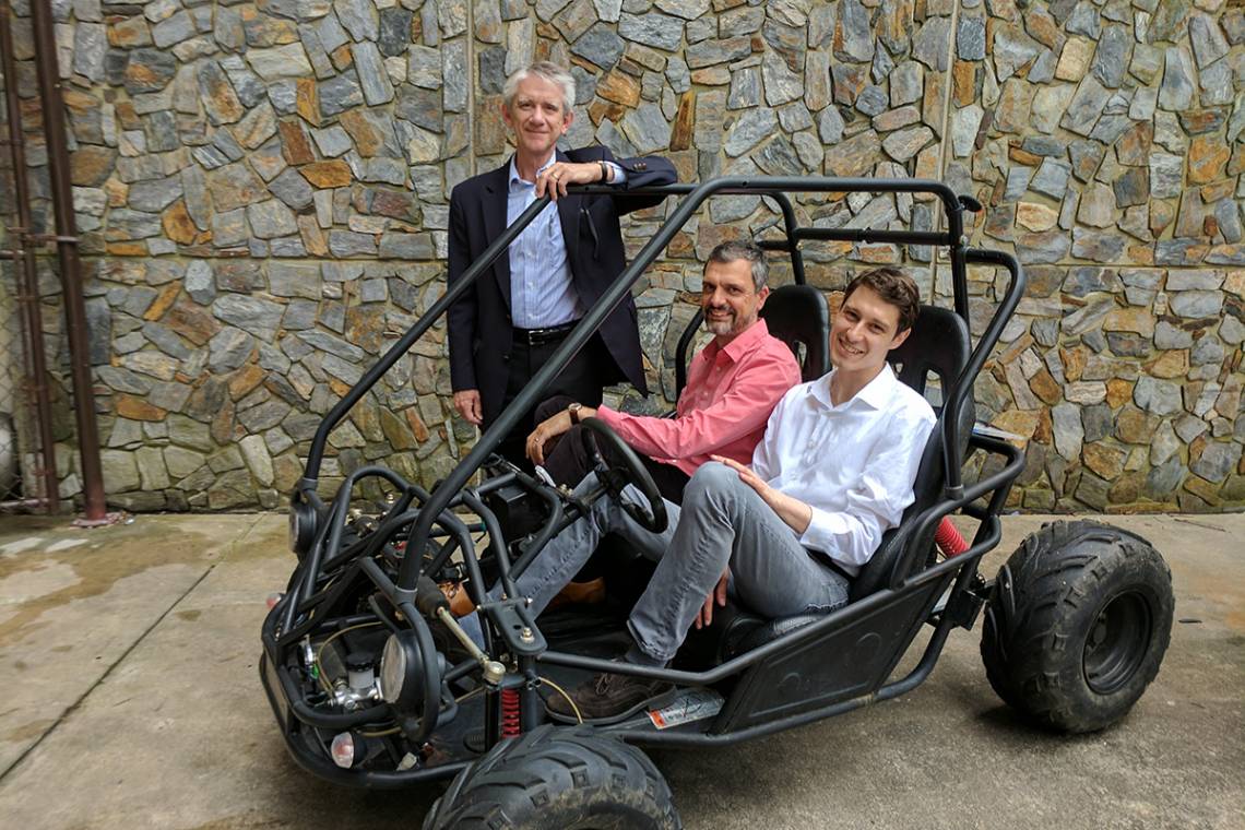 Mechanical engineering professor Josiah Knight, standing, with neuroscientists Angel Peterchev and Stefan Goetz on right. The team’s new battery and power conversion system will be the heart of this student-built vehicle for the Shell Eco-Marathon.