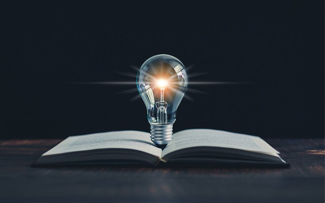 a lightbulb and a book