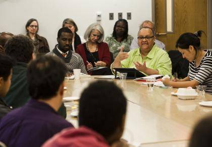 Michael Ralph, center at table, and Wahneema Lubiano lead a discussion of