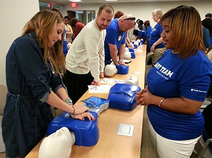 In December, 261 Duke employees took free compression-only CPR classes at the Duke Medicine Pavilion. The training included practicing compressions on a manikin. Photo by April Dudash