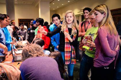 Computer science and math double major Mollie Breen and teammates show off a remote temperature sensor they developed at an event called