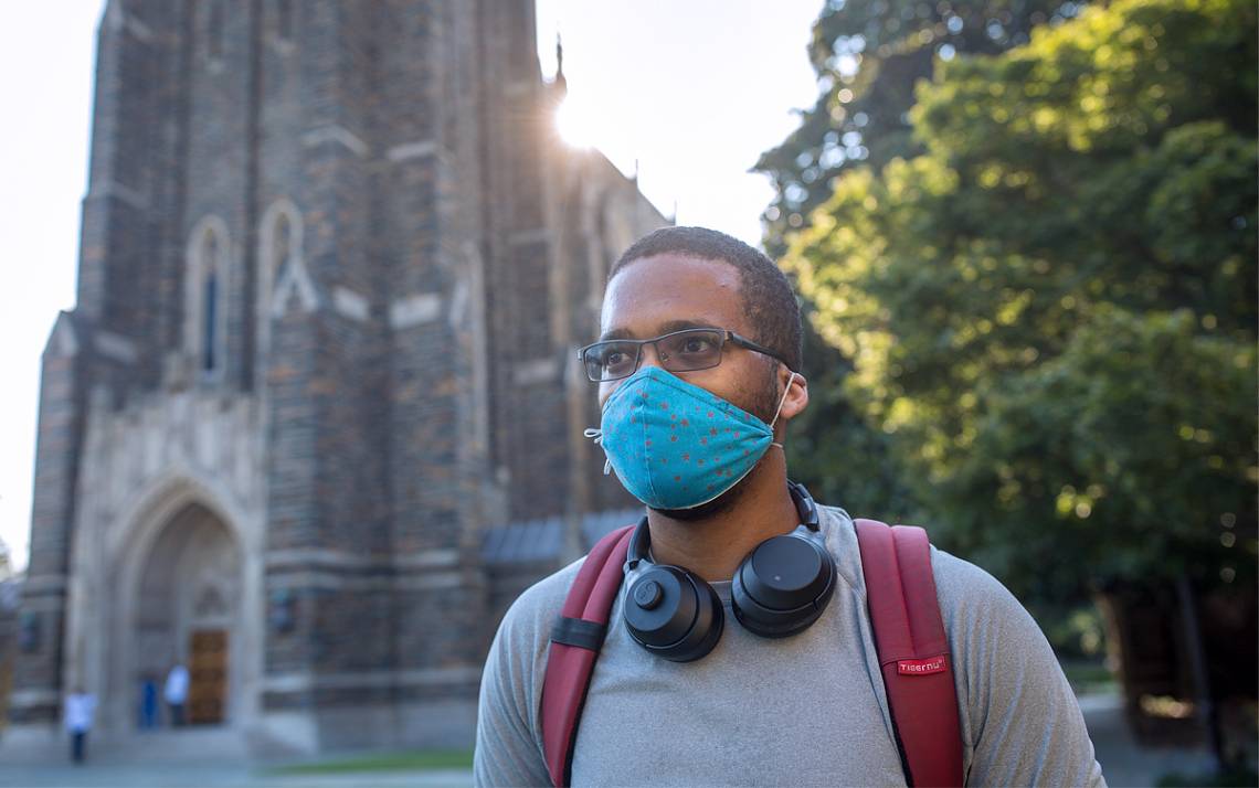 A student wears a mask on Duke's campus.