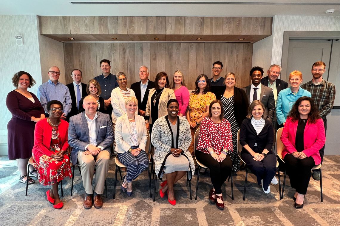 Agroup photo of the Western NC regional cohort on adequate housing in Asheville, May 2022