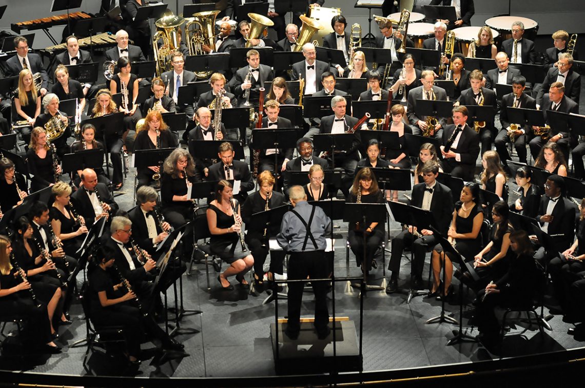 Paul Bryan conducts the Wind Symphony and alumni in a 2013 concert honoring him.