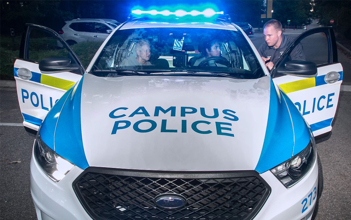 Participants in the 2019 Citizen's Police Academy take part in a simulated traffic stop. Photo by Chris Hildreth.