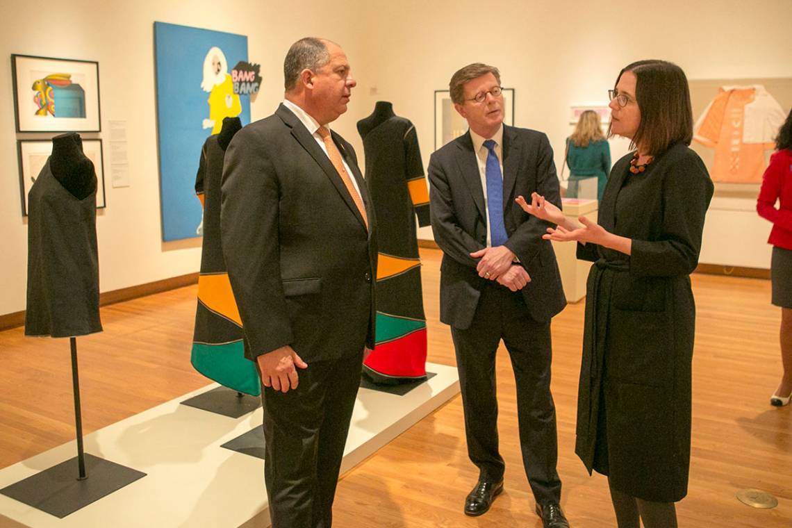 The former president of Costa Rica and Duke President Vincent Price discuss Latin American and Latino/a art with Romance Studies professor Esther Gabara during a visit to the exhibit she curated for the Nasher Museum of Art. Recent funding from The Duke E