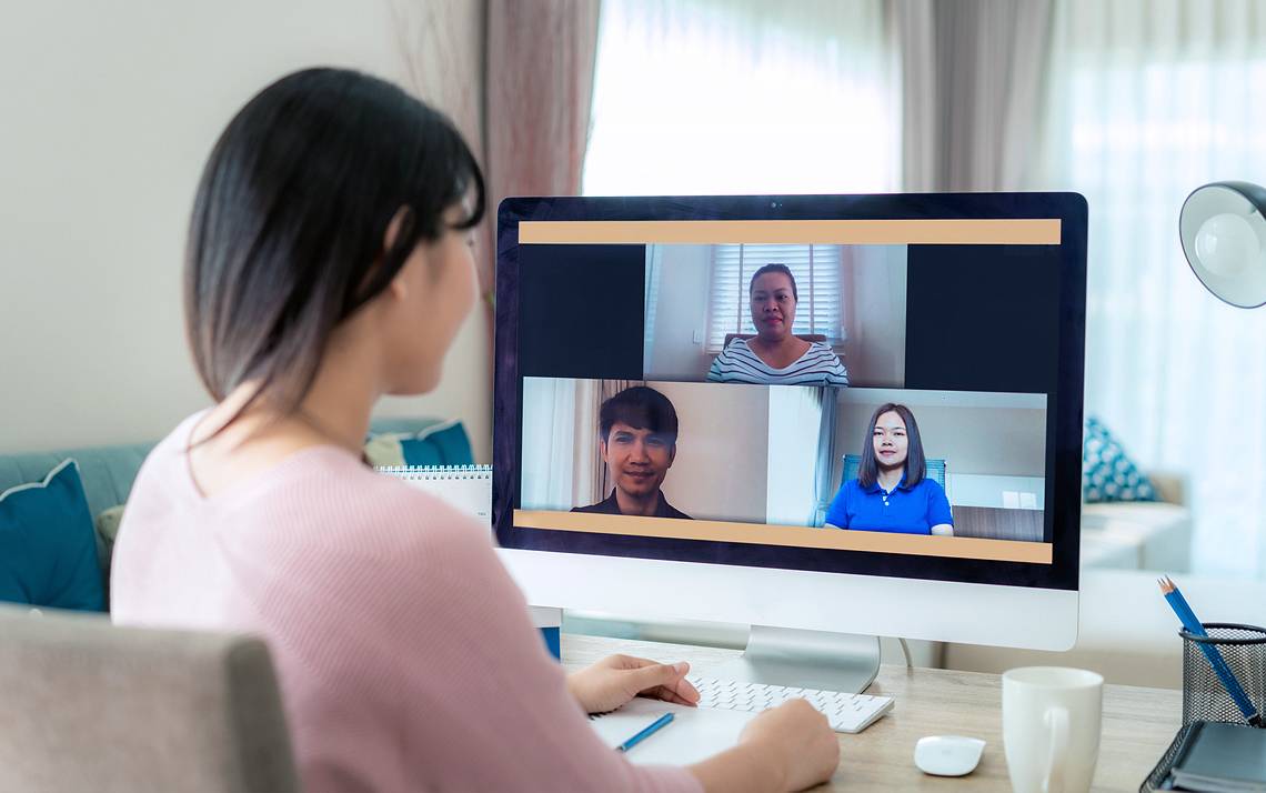 A person taking colleagues in a Zoom meeting.