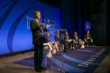 Vince Price comments on faculty presentations on public communication at the faculty symposium Thursday. Photo by Duke Photography