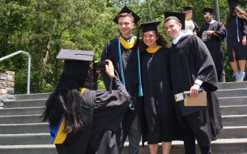 Graduates from the Nicholas School of the Environment pose for photos. Photo courtesy of the Nicholas School of the Environment.