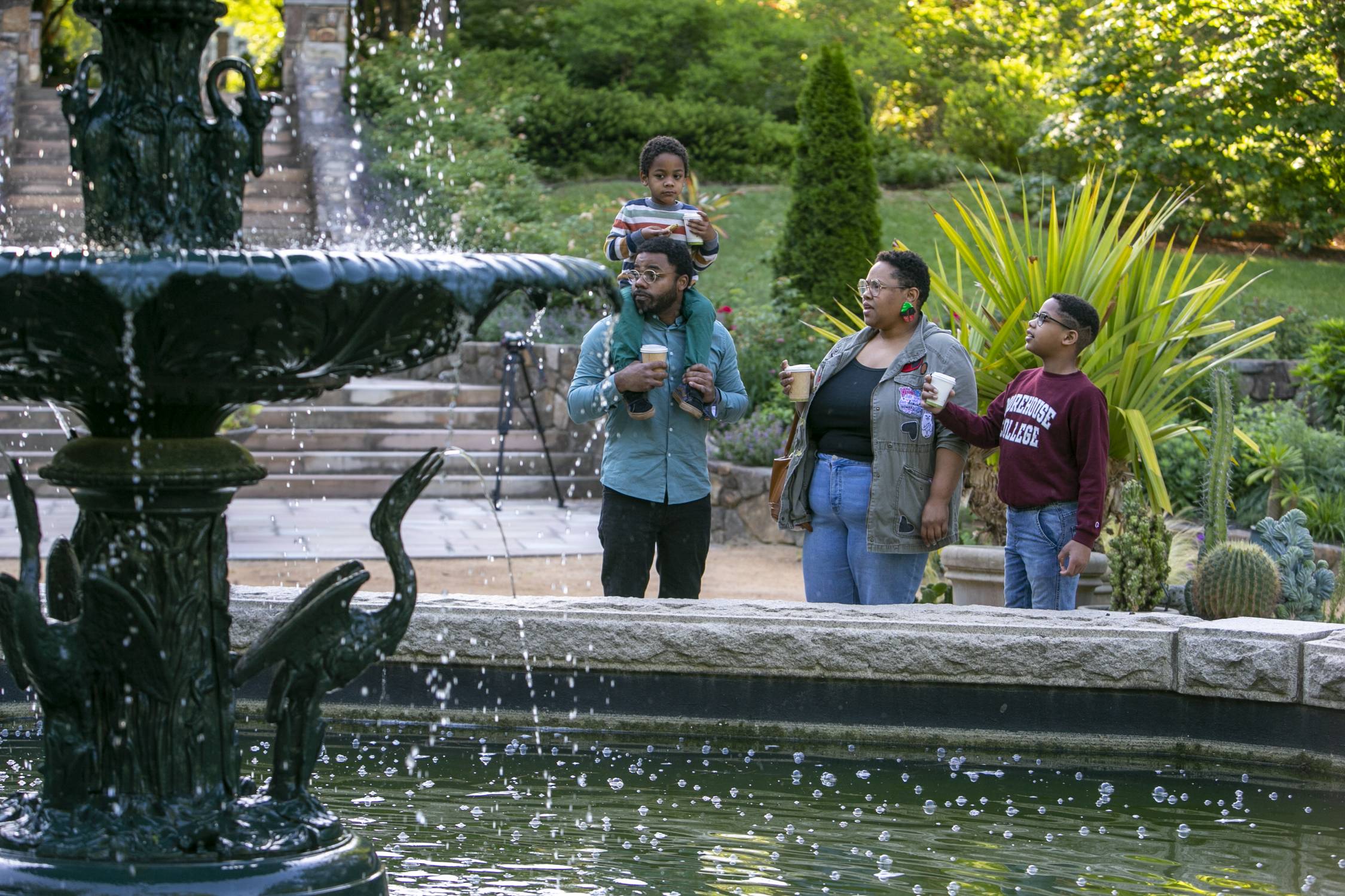 The Miller family of Raleigh (Duane and Victoria with sons Emerson, 5, and Langston, 10) enjoy a morning walk through the Sarah P. Duke Gardens' first day of reopening to the public.