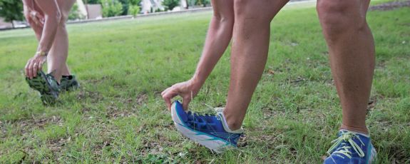 Duke employees stretch on East Campus.