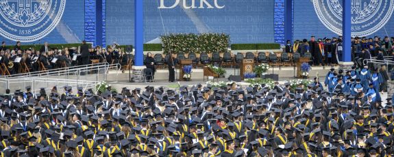 A crowd of graduates in Wallace Wade stadium