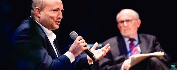 Former Israeli prime minister Naftali Bennett speaks in Page Auditorium with moderator Bruce Jentleson