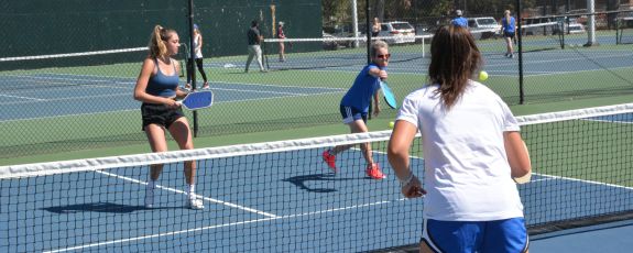 Players engage in pickleball on East Campus