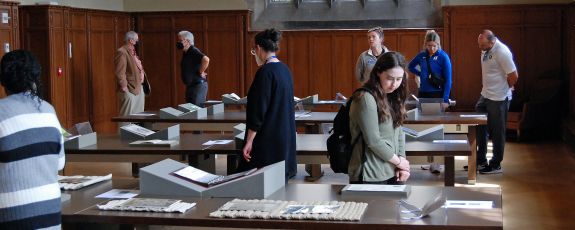 Attendees for "I Got a Story to Tell: Black Voices in Print" in the Gothic Reading Room look through materials on display. Photo by Jack Frederick.