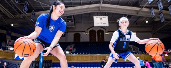 Vanessa de Jesus trains with young girl on dribble skills
