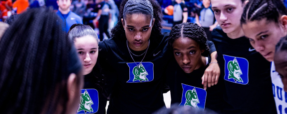 Women's basketball team in recycled shooting shirts.