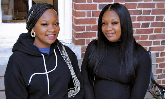 Tierra Brodie, left, and Ciarra Brodie, are twins who have spent their entire working careers at Duke. Photo by Jack Frederick.