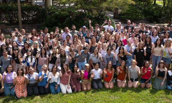 Members of the Nicholas School courtyard are together in a group photo in the school's courtyard