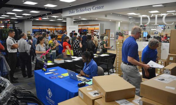 Patrons stand in line at the Duke Technology Center to pick up their purchases before the pandemic.