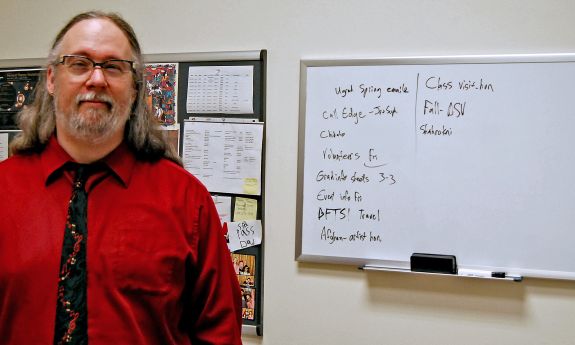 Jeremy Boomhower uses a white board to track his to-do list. Photo by Jack Frederick.