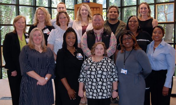 The 2023 cohort of the Front Line Supervisors Program gather on the stairs of the Freeman Center for Jewish Life. Photo by Jack Frederick.
