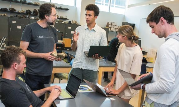 Professor Alex Glass with students in the UNIV102 class this past year.