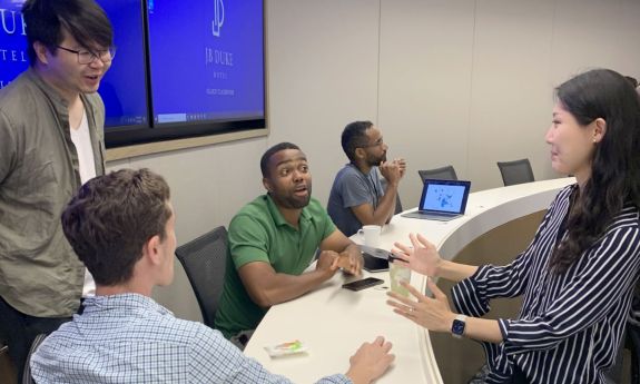 Cook Center students talk between sessions of Diversity Initiative for Tenure in Economics Fellowship Program.
