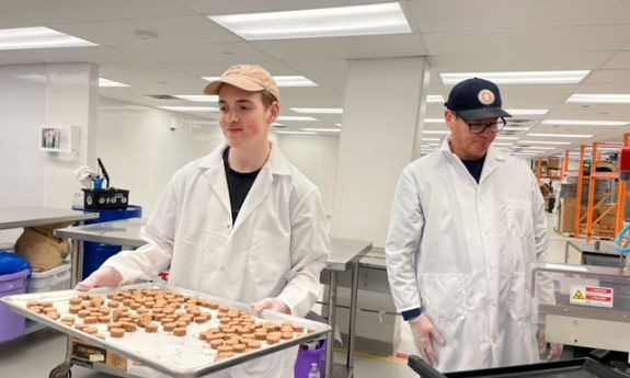 Liam Frumkin and his father baking cookie dough bite snacks.