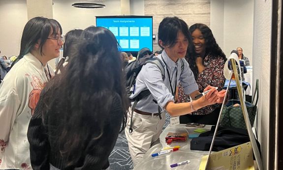 Master's students at workshop collaborate on ideas for encouraging more sustainable efforts.