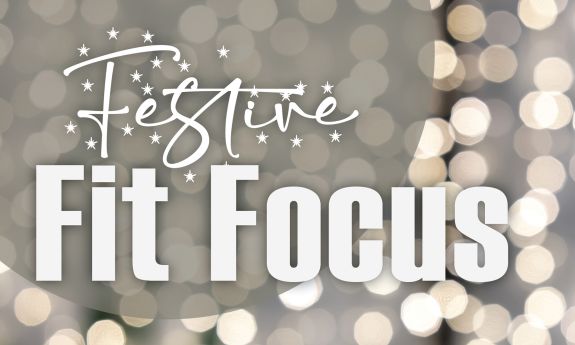 A graphic reads "Festive Fit Focus" with holiday lights in the background.