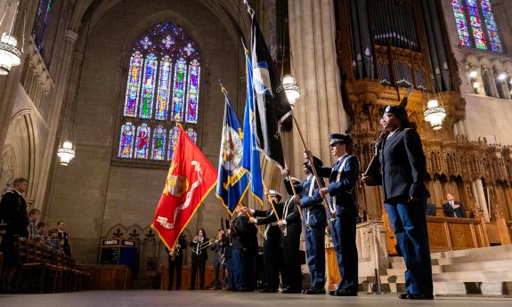 Duke ROTC members hold flags at the Veterans Day ceremony at Duke Chapel.