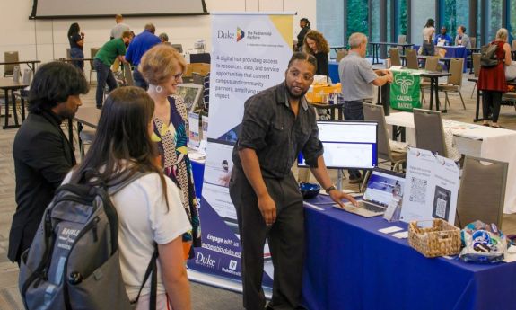 Duke students learn about the Partnership Platform at the Volunteer Fair with community groups.