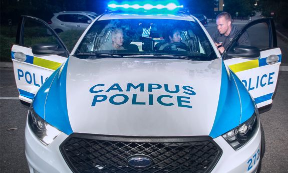 Participants in the 2019 Citizen's Police Academy take part in a simulated traffic stop. Photo by Chris Hildreth.