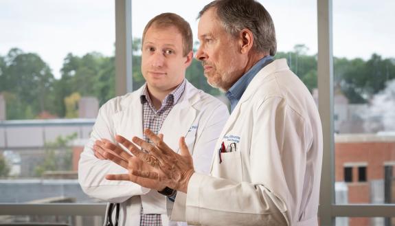 Hematology/oncology fellow Ryne Ramaker (left), and clinician Jim Abbruzzese aim to translate a potential early diagnostic test for pancreatic cancer from the lab to the clinic. Photo by Les Todd.