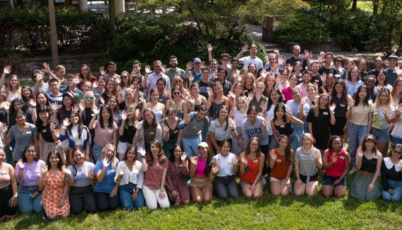 Members of the Nicholas School courtyard are together in a group photo in the school's courtyard