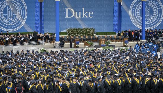 A crowd of graduates in Wallace Wade stadium