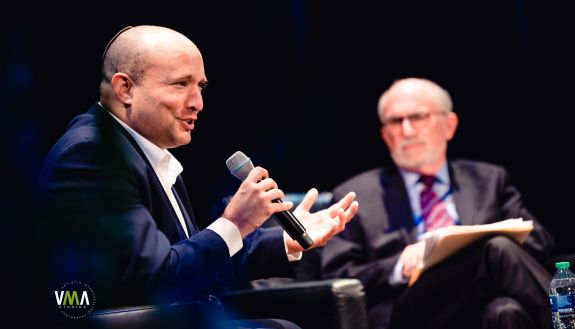 Former Israeli prime minister Naftali Bennett speaks in Page Auditorium with moderator Bruce Jentleson