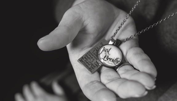 Berry wears a reminder of her training in managing work-related stressors. Photo by Chris Hildreth