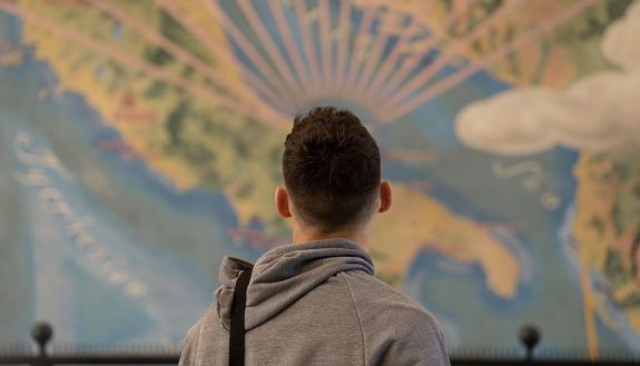 student looking at map of Italy during AGS staff ride to Italy