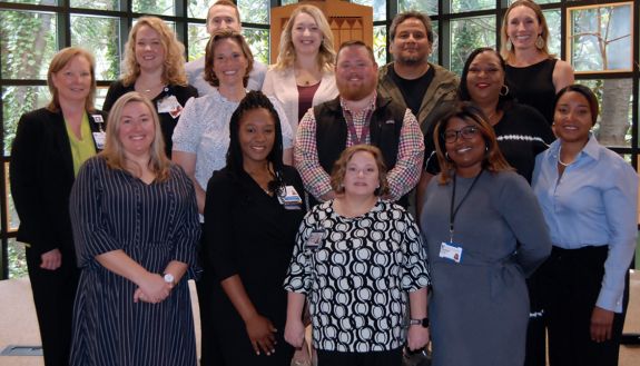 The 2023 cohort of the Front Line Supervisors Program gather on the stairs of the Freeman Center for Jewish Life. Photo by Jack Frederick.