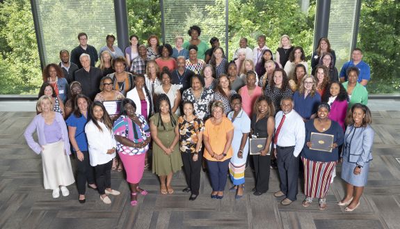 Learning & Organization Development certificate of excellence graduates gather in Penn Pavilion on July 19. Photo by Les Todd.