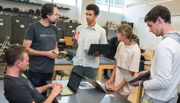 Professor Alex Glass with students in the UNIV102 class this past year.