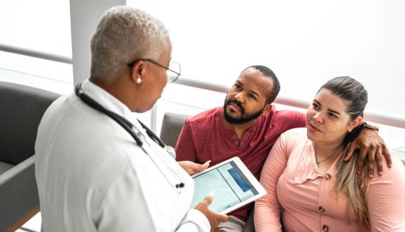 stock image of a couple with a doctor