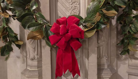 A red ribbon on garland. 