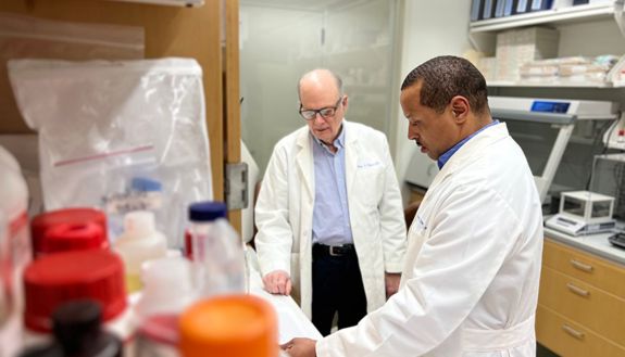 Kevin Saunders, PhD (right), consulting with Barton Haynes, MD, at the Duke Human Vaccine Institute.