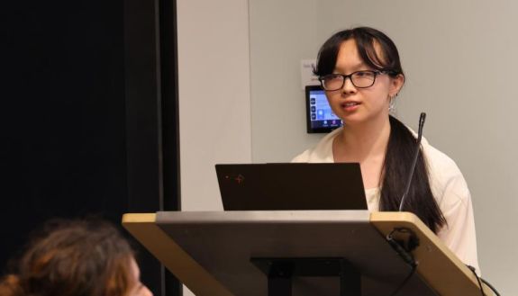 Student speaking at a podium